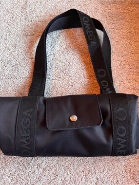 Omega Black Logo-Strap Roll Shoulder Bag. USED ONCE!